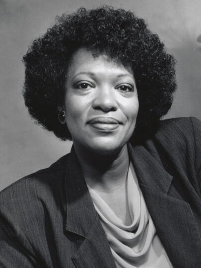 A black and white portrait of Rita Dove.