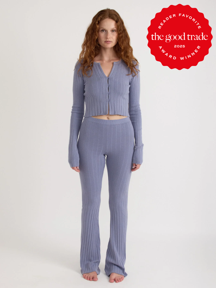 Person wearing a textured lavender knit outfit stands barefoot against a plain background. A red badge reads "Reader Favorite - AlsWell Blog Award Winner 2023.